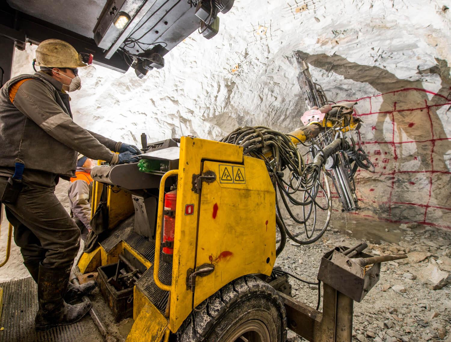 Underground Mine Worker on Machinery